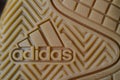 Adidas sign on sole of the shoe