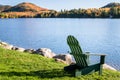 Adirondack Chair Facing a Mountain Lake on a Sunny Morning Royalty Free Stock Photo