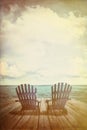 Adirondack chairs on dock with vintage textures and feel Royalty Free Stock Photo