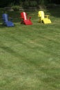 Adirondack chairs on manicured lawn