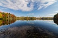 Adirondack lake in St Regis Wilderness with peak fall foliage on a peaceful calm morning Royalty Free Stock Photo