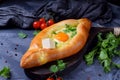 Adjarian khachapuri. Traditional meal of Georgian cuisine made of yeast dough with sulguni cheese and egg yolk