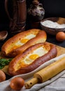 Adjarian khachapuri on a wooden Board. Homemade cake