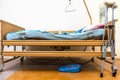 adjustable hospital bed and crutches at home