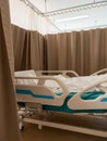 The adjustable hospital bed with a patient lying in the white blanket Royalty Free Stock Photo