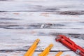 Adjustable wrench and folding ruler on wooden background. Royalty Free Stock Photo