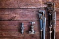 Adjustable wrench on a grungy wooden background Royalty Free Stock Photo