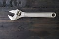 Adjustable wrench or monkey wrench on a wooden table Royalty Free Stock Photo