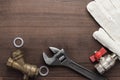 Adjustable wrench and pipes Royalty Free Stock Photo