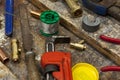 Adjustable wrench and plumbing fittings on a work bench
