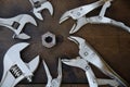 Adjustable wrench or spanner wrench and Locking pliers on wooden background, Prepare basic hand tools for work