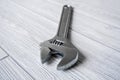 Adjustable wrench on the table close up Royalty Free Stock Photo