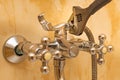 adjustable wrench tightening a nut on a water faucet Royalty Free Stock Photo
