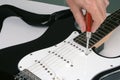 Adjusting electric guitar