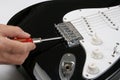 Adjusting electric guitar