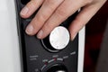 Adjusting heat control on a radiator. Royalty Free Stock Photo