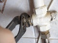 Adjustment by means of pliers of the gas valve in the house. Danger of explosion of household gas in the house, Astarachay Royalty Free Stock Photo