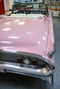 ADLER, RUSSIA - JANUARY 30, 2022: Rear view of a large pink American convertible retro car in the Nik Panuli Automobile Museum of