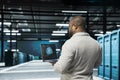 Admin in data center using artificial intelligence simulating human brain Royalty Free Stock Photo