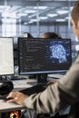 Admin implementing artificial intelligence cybersecurity measures in data center