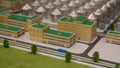 Administration block model overlooking storage domes and service roads, architect reviewing masterplan, corporate and Royalty Free Stock Photo