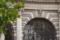 Admiralty Arch in London, England - detail of central gate and Royal coat of arms