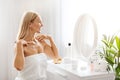 Admiring Beauty. Attractive Middle Aged Woman Sitting At Dressing Table At Home Royalty Free Stock Photo