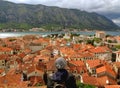Admiring Orange Color Tiled Roof of Kotor Old City and Kotor Bay from Fortification of Kotor, Montenegro