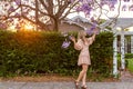 Admiring the purple Jacaranda tree flower clusters