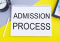 Admission Process Text Written On A Notebook With Pencil, Yellow And Gray Background