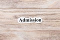 ADMISSIONS of the word on paper. concept. Words of ADMISSIONS on a wooden background Royalty Free Stock Photo