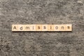 admissions word written on wood block. admissions text on table, concept Royalty Free Stock Photo