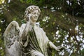 Admonishing angel with sunbeams in a cemetery