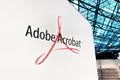 Adobe Acrobat logo on white wall inside modern building illustrative Royalty Free Stock Photo