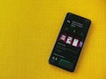Adobe Capture - Vector and Pattern Maker app play store page on smartphone on a yellow fabric background