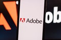 Adobe company logo on smartphone screen. Royalty Free Stock Photo