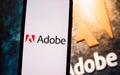 Adobe company logo on smartphone screen. Royalty Free Stock Photo