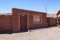 Adobe house in Cerrillos village on Bolivian Altiplano near Eduardo Avaroa Andean Fauna National Reserve with blue sky, Bolivia Royalty Free Stock Photo