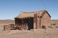 Adobe house in Cerrillos village on Bolivian Altiplano near Eduardo Avaroa Andean Fauna National Reserve with blue sky, Bolivia Royalty Free Stock Photo