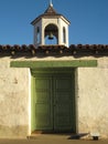 Adobe House with green doors Royalty Free Stock Photo