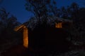 Adobe hut with thatched roof at night Royalty Free Stock Photo