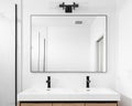 adobe istockA bathroom detail with a wood cabinet and large mirror. Royalty Free Stock Photo