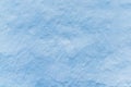 Adobe whitewashed wall in light blue color, traces of brush, background with copy space for text or objects