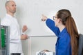 adolescent student pointing to whiteboard Royalty Free Stock Photo