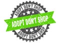 Adopt don`t shop stamp. grunge round sign with ribbon