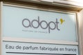 Adopt sign text and brand logo wall facade cosmetics store adopt