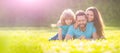 Family day. Banner of Happy family Lying on grass. Young mother and father with child son in the park resting together Royalty Free Stock Photo