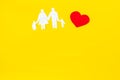 Adoption word and family figure for adopt child concept on yellow background top view mock up