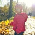 Adorabl little baby girl walking in the park in red jacket Royalty Free Stock Photo