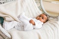 Adorable african american baby boy indoors lying Royalty Free Stock Photo